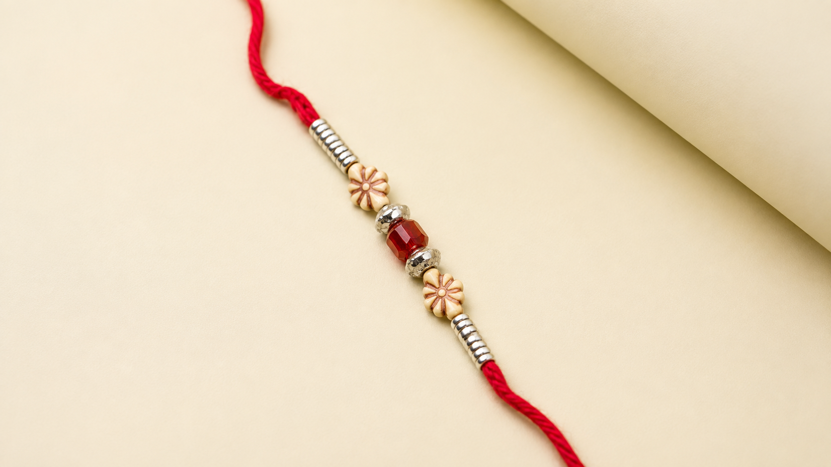 Traditional Red Thread Floral Bead Rakhi